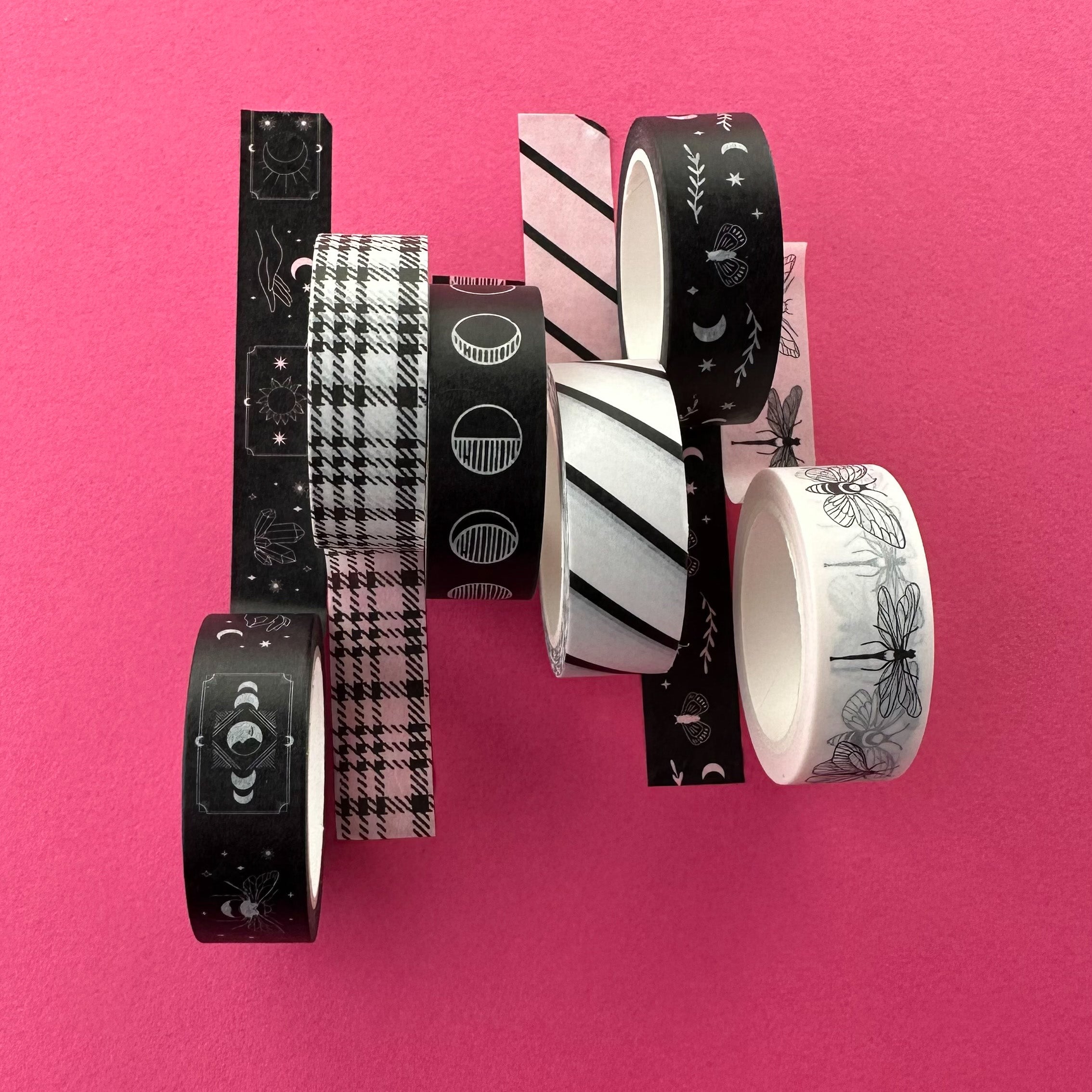 This photo is some of our black and white pattern washi tape. These beauties are perfect to adorn your planner or journal with our charming black hand-drawn heart washi tape on a vibrant pink backdrop, This tape is sold at BBB Supplies Craft Shop.