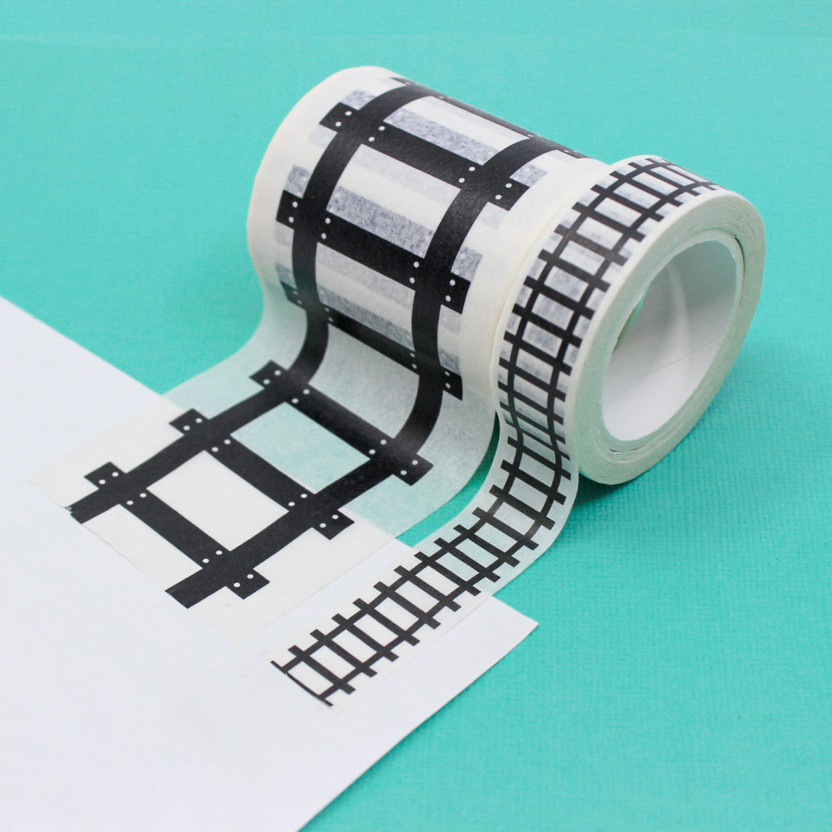 Fuel imagination and play with our traintrack road-themed washi tape for kids' playtime, featuring a playful road design perfect for creating roads and pathways for toy cars and adventures. This tape is sold at BBB Supplies Craft Shop.