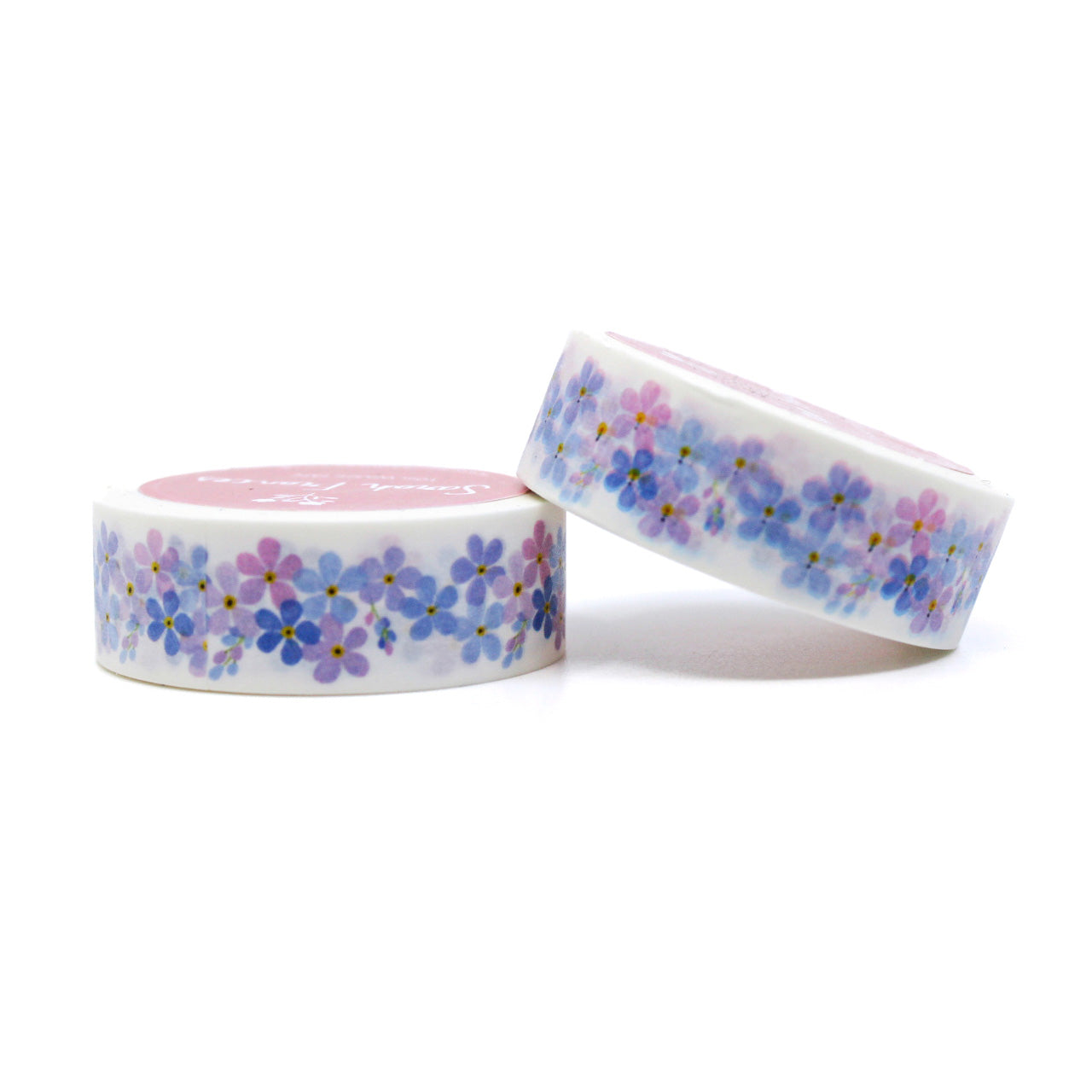 "Purple Forget-Me-Nots Floral Washi Tape" showcases a beautiful pattern of delicate purple forget-me-not flowers, perfect for adding a touch of floral elegance to your creative projects.