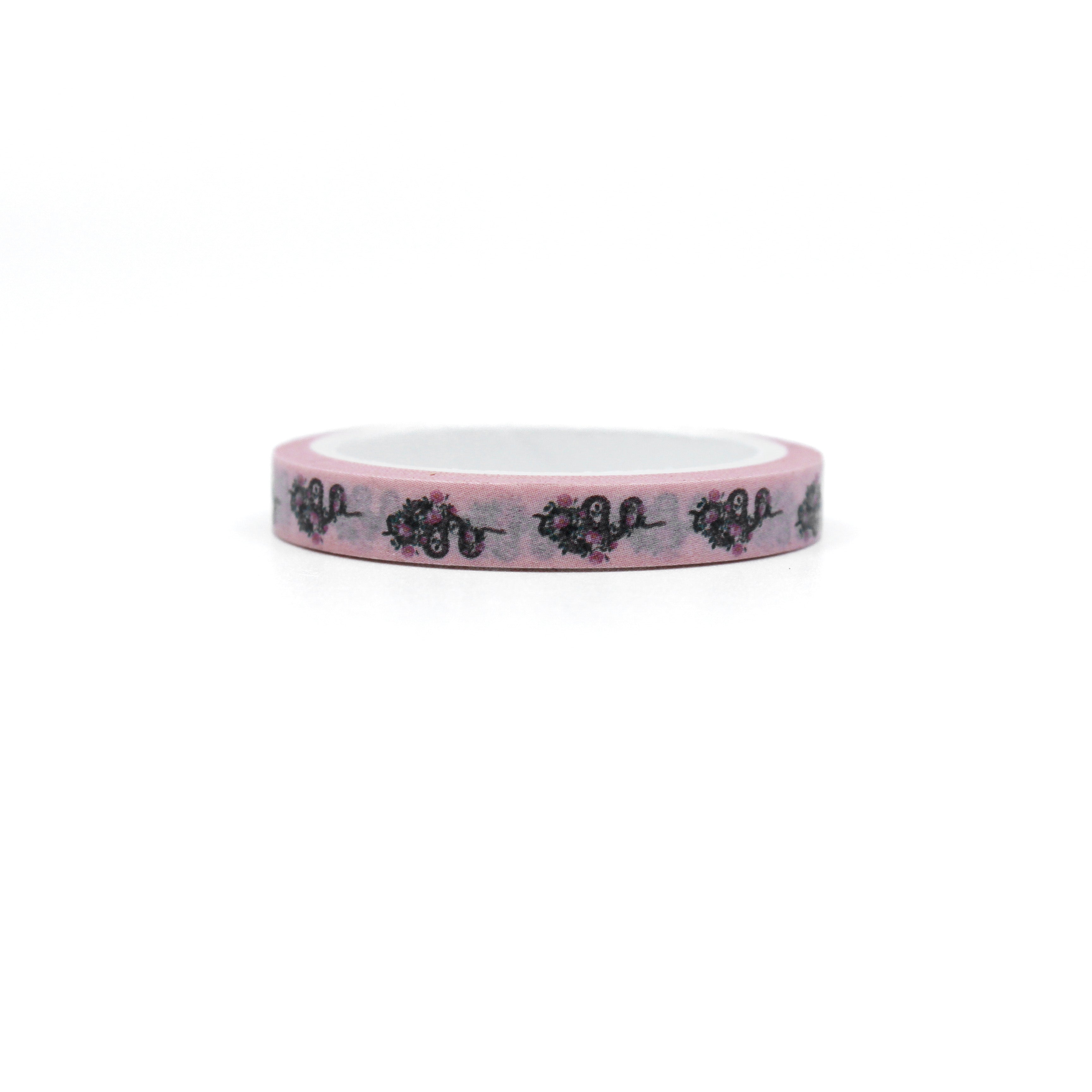 Infuse your creations with a fusion of tattoo-inspired artistry using our washi tape adorned with pink snakes and intricate floral patterns, creating a unique and captivating accent for your crafts. This tape is sold at BBB Supplies Craft Shop.