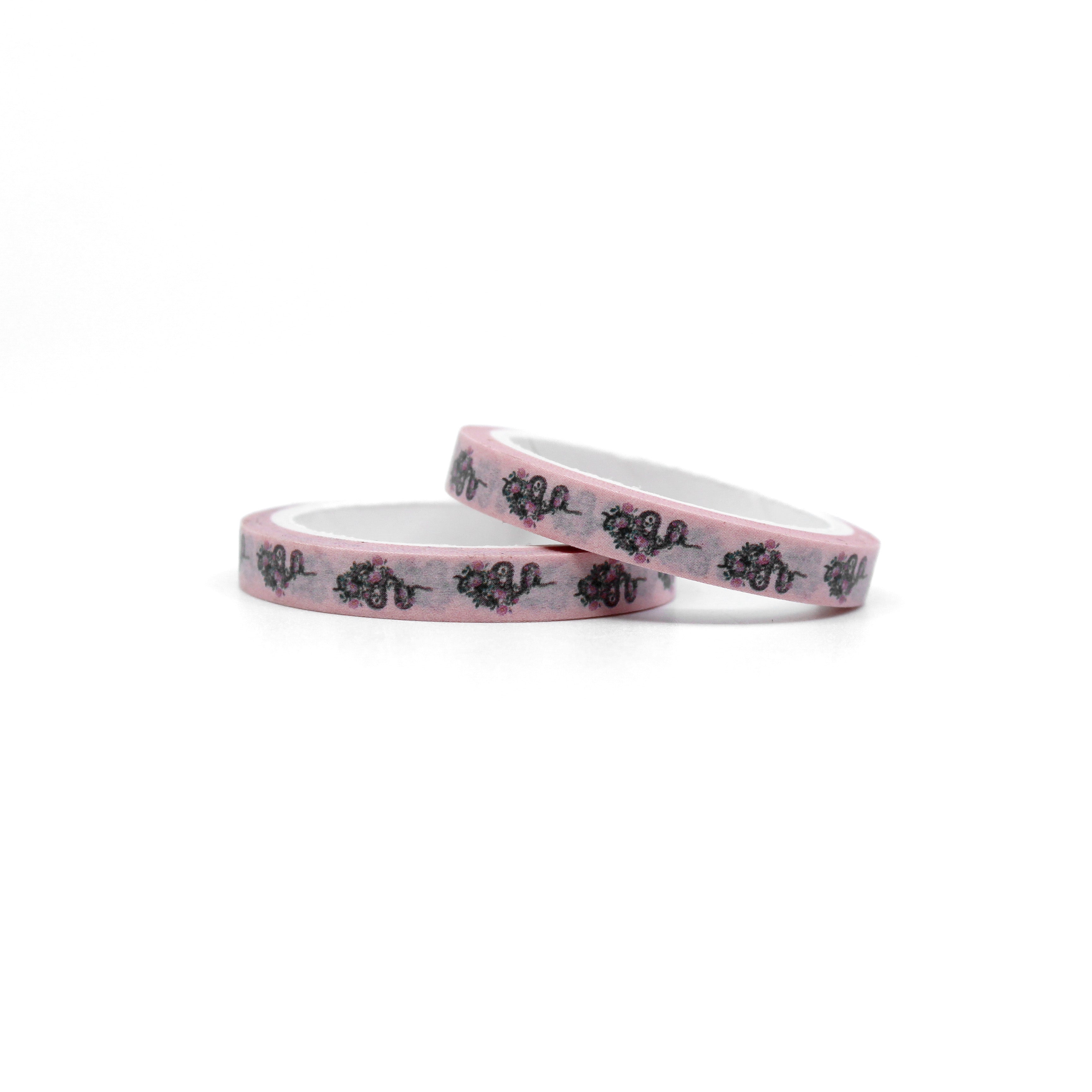 Infuse your creations with a fusion of tattoo-inspired artistry using our washi tape adorned with pink snakes and intricate floral patterns, creating a unique and captivating accent for your crafts. This tape is sold at BBB Supplies Craft Shop.