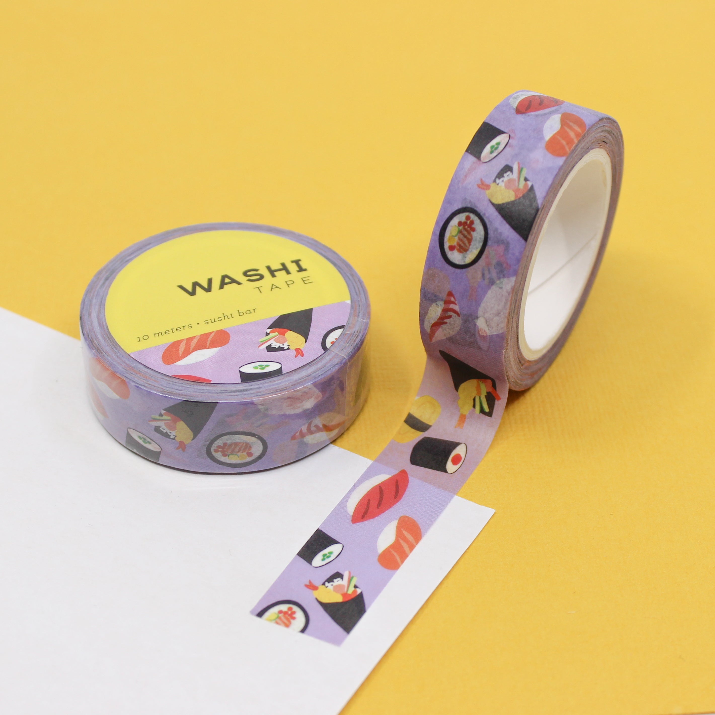 Add a tasty twist to your crafts with our Sushi Washi Tape, featuring delightful sushi illustrations. Perfect for adding a touch of Japanese culinary charm to your projects. This tape is designed by Girl of All Work and sold at BBB Supplies Craft Shop.
