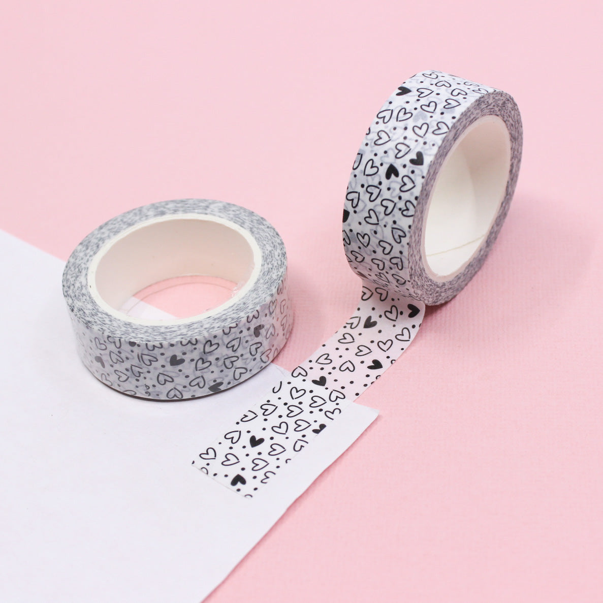 Add a playful touch to your crafts with this fun and modern black and white hearts washi tape. Featuring a stylish heart pattern, this tape is perfect for adding a pop of pattern to your projects. Use it to decorate scrapbook pages, greeting cards, and more! This tape is sold at BBB Supplies Craft Shop.