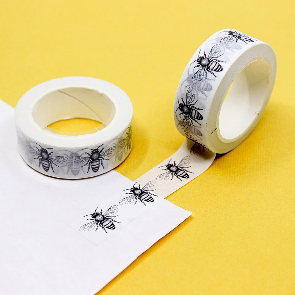 Add a touch of nature to your crafts with this charming washi tape featuring black and white bees. Perfect for nature lovers, gardeners, or anyone who enjoys a whimsical touch, this tape is ideal for scrapbooking, card-making, journaling, and more. This tape is sold at BBB Supplies Craft Shop.