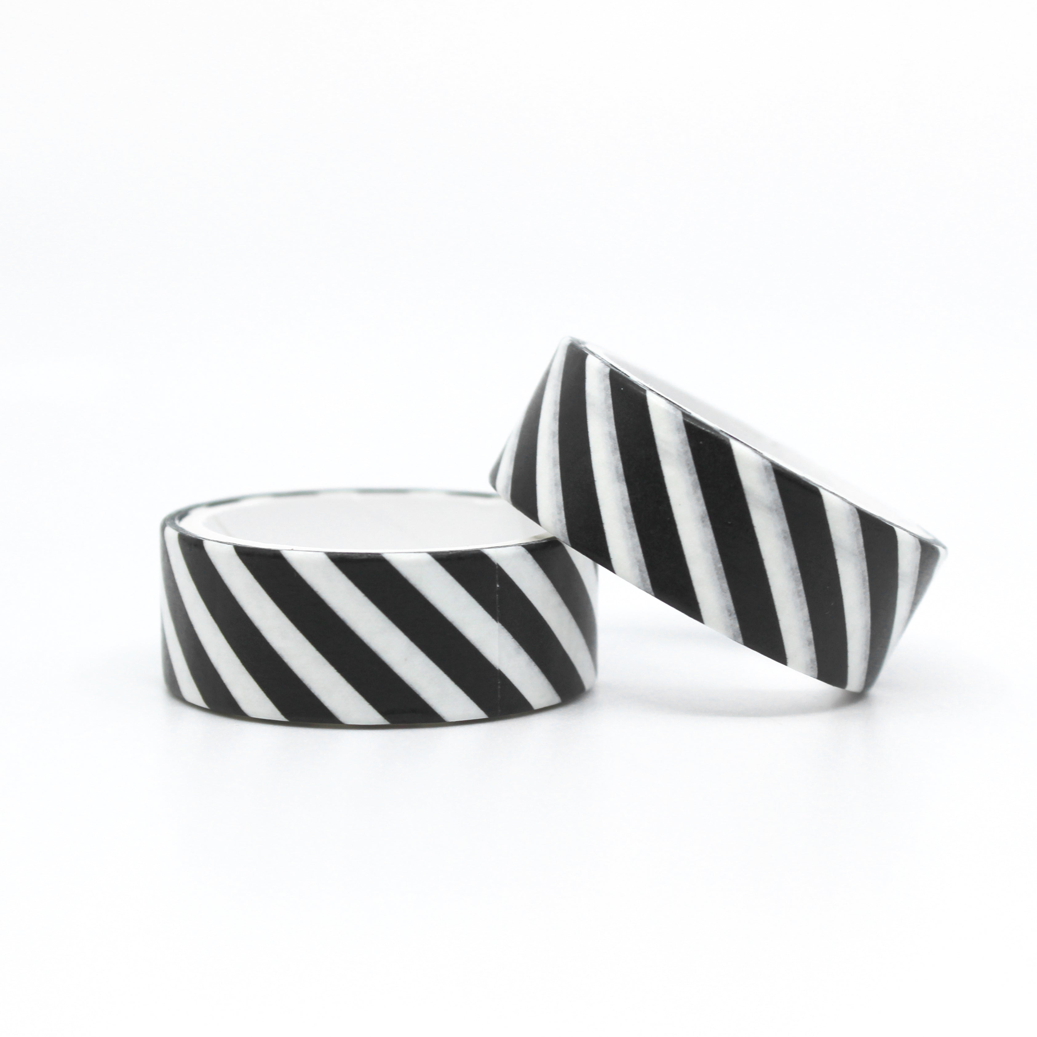 Add a touch of modern sophistication with our black and white striped washi tape, featuring a sleek and stylish pattern of diagonal stripes. This tape is sold at BBB Supplies Craft Shop.