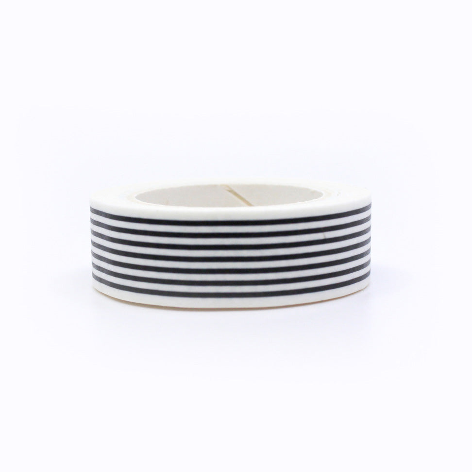 Add a timeless touch to your projects with our Classic Black & White Stripe Washi Tape, featuring a stylish and versatile stripe pattern. Ideal for creating a sleek and sophisticated look. This tape is sold at BBB Supplies Craft Shop.