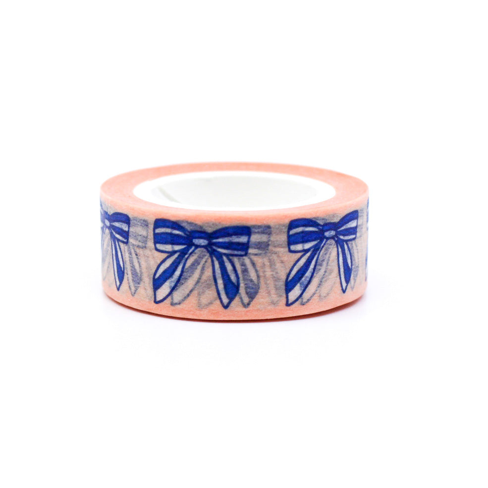 "Blue Bows & Ribbons Washi Tape" features a charming design of blue bows and ribbons, adding a touch of elegance and whimsy to your crafts, journals, and gift wrapping.