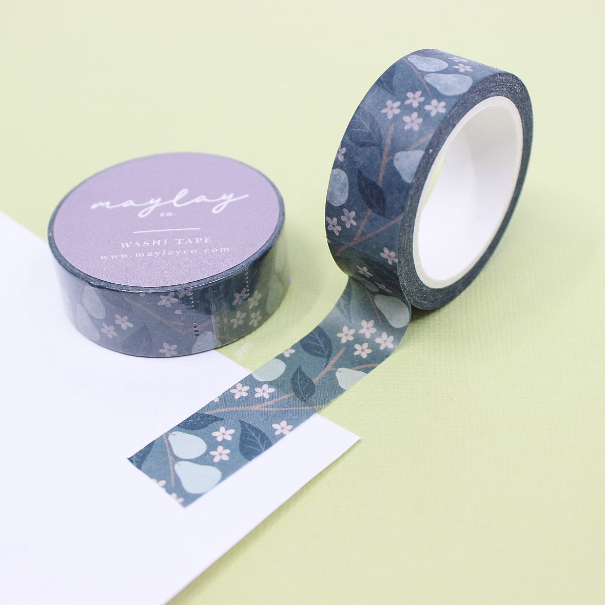 
"Blue Winter Pears Washi" features a charming pattern of blue pears, perfect for adding a seasonal touch to holiday-themed crafts or journaling.