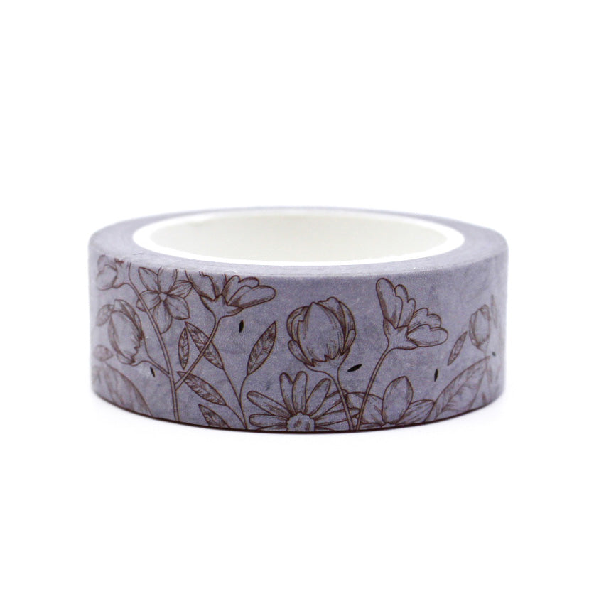 Add a subtle floral touch to your crafts with this elegant neutral linea floral washi tape. Perfect for adding a sophisticated accent to your journals, scrapbooks, and other projects. This tape is sold at BBB Supplies Craft Shop.