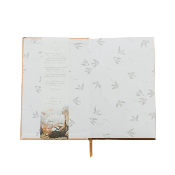 This peach color childhood history journal has prompts to help parents write their child's story in each phase as a keepsake. This journal is from promptly and sold at BBB Supplies Craft Shop.