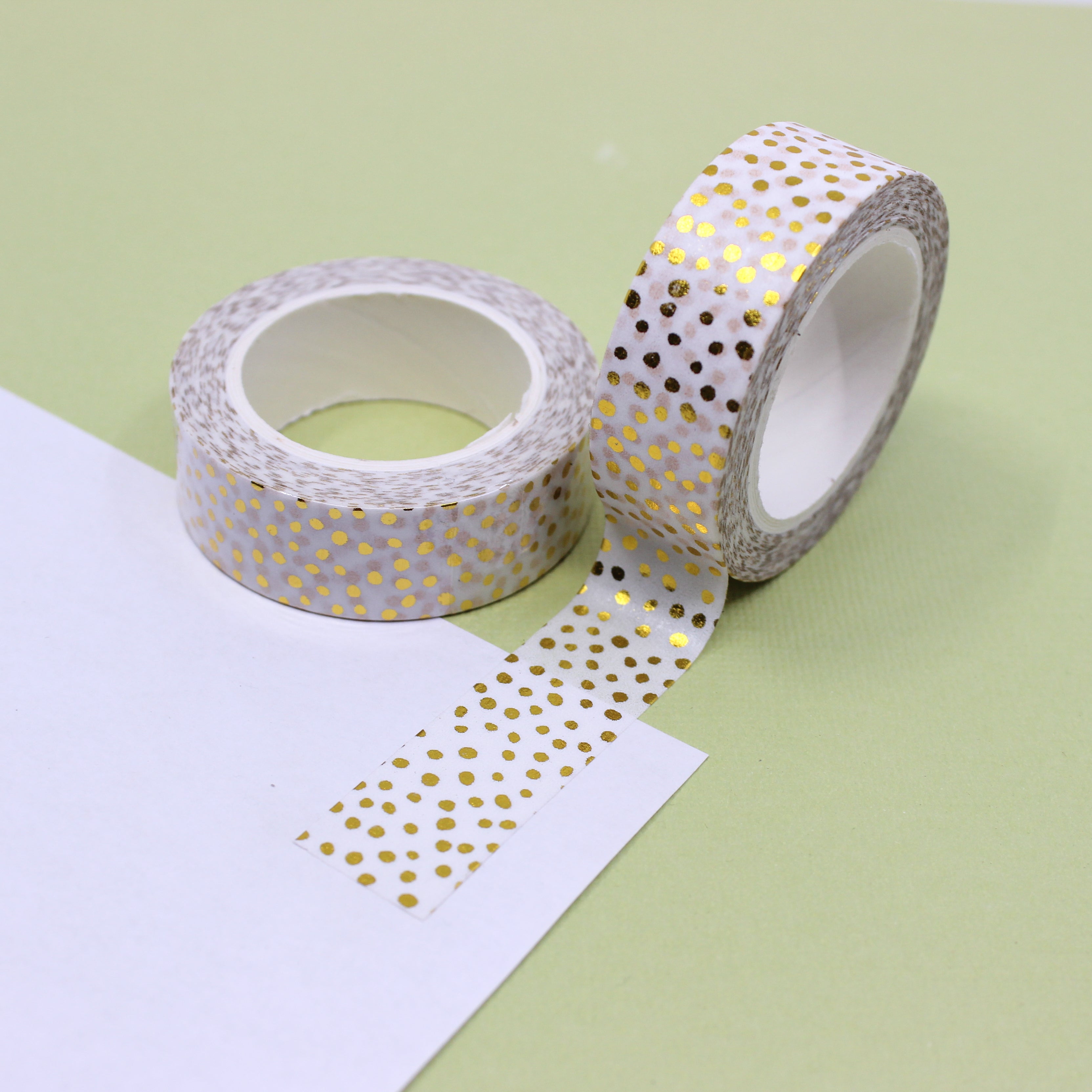 Elevate your crafts with our glamorous gold foil washi tape adorned with playful polka dots and shimmering party confetti, perfect for adding a touch of joy and excitement. This tape is sold at BBB Supplies Craft Shop.