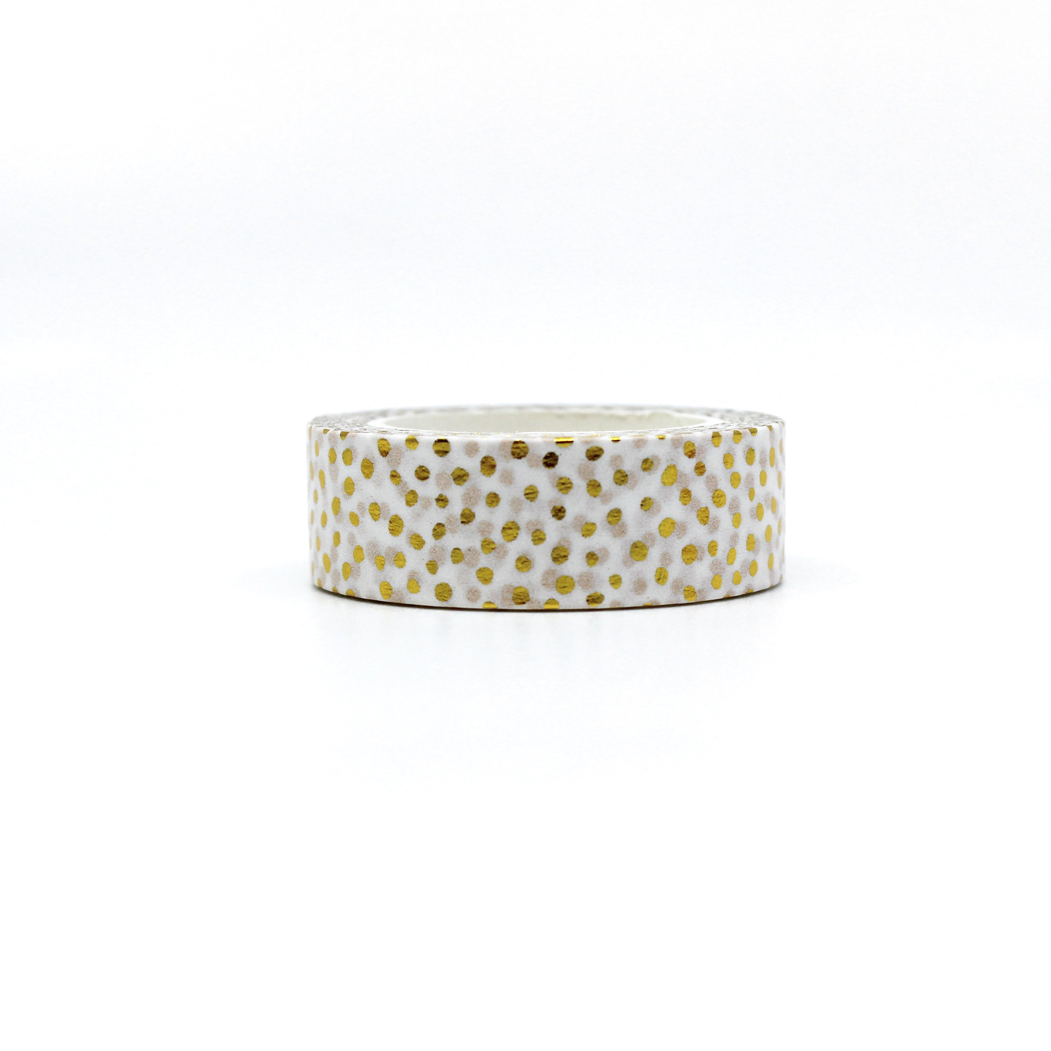 Elevate your crafts with our glamorous gold foil dotted washi tape adorned with playful polka dots and shimmering party confetti, perfect for adding a touch of joy and excitement. This tape is sold at BBB Supplies Craft Shop.