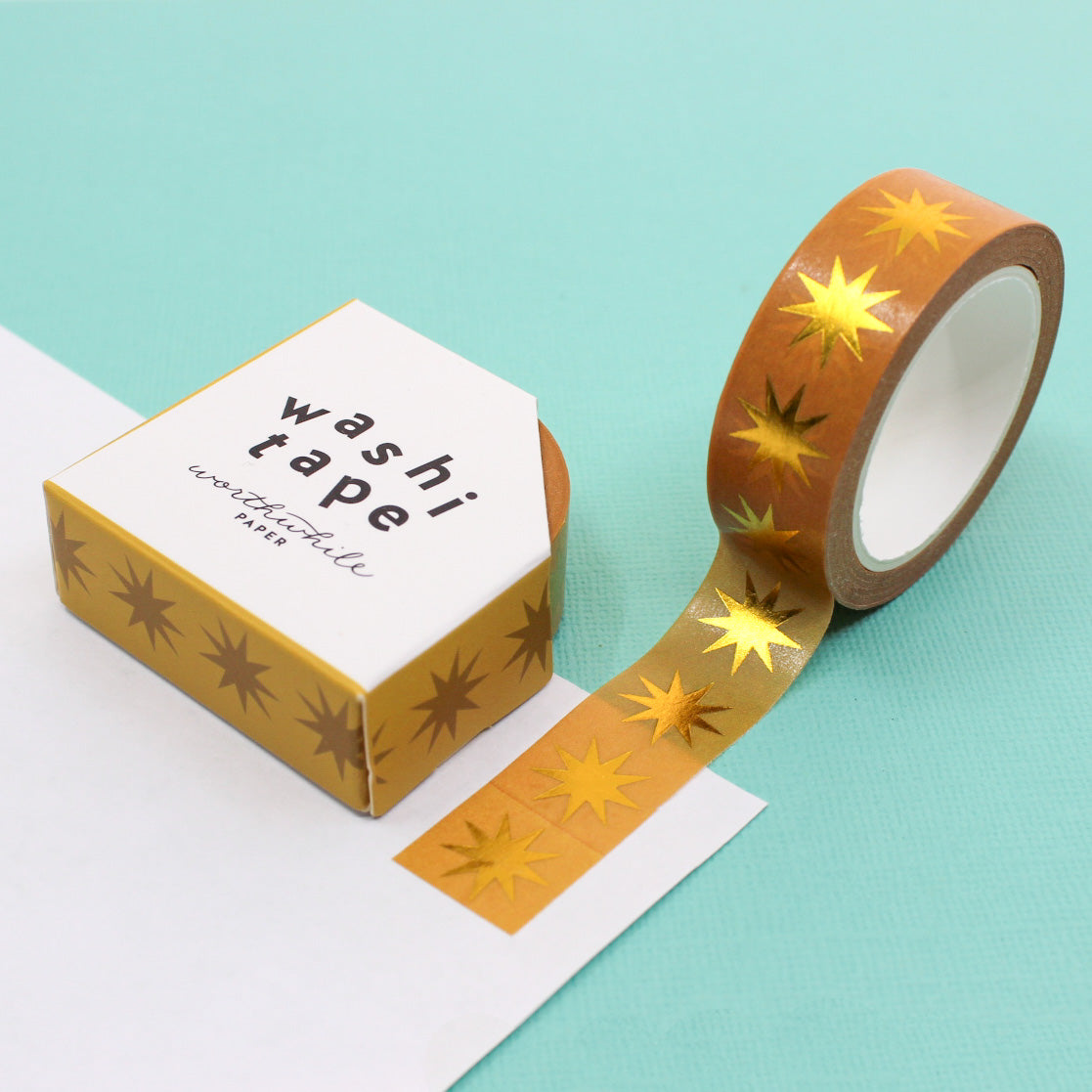 Add a touch of timeless glamour to your projects with our Retro Gold Star Washi Tape. This tape features a classic design of golden stars against a yellow Ochre backdrop. giving your creations a touch of vintage elegance. Perfect for embellishing scrapbooks, planners, or crafting personalized cards, this washi tape brings a nostalgic charm. This tape is from Worthwhile Paper and sold at BBB Supplies Craft Shop.