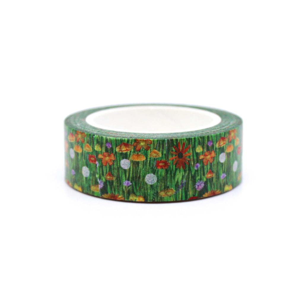 This green field of wildflowers washi tape adds a fresh, natural touch to your crafts. Its soft, but vibrant red, orange, and yellow tones on a green grassy backdrop make it a versatile addition to your stationery collection, offering a gentle yet vibrant accent to your creative projects.