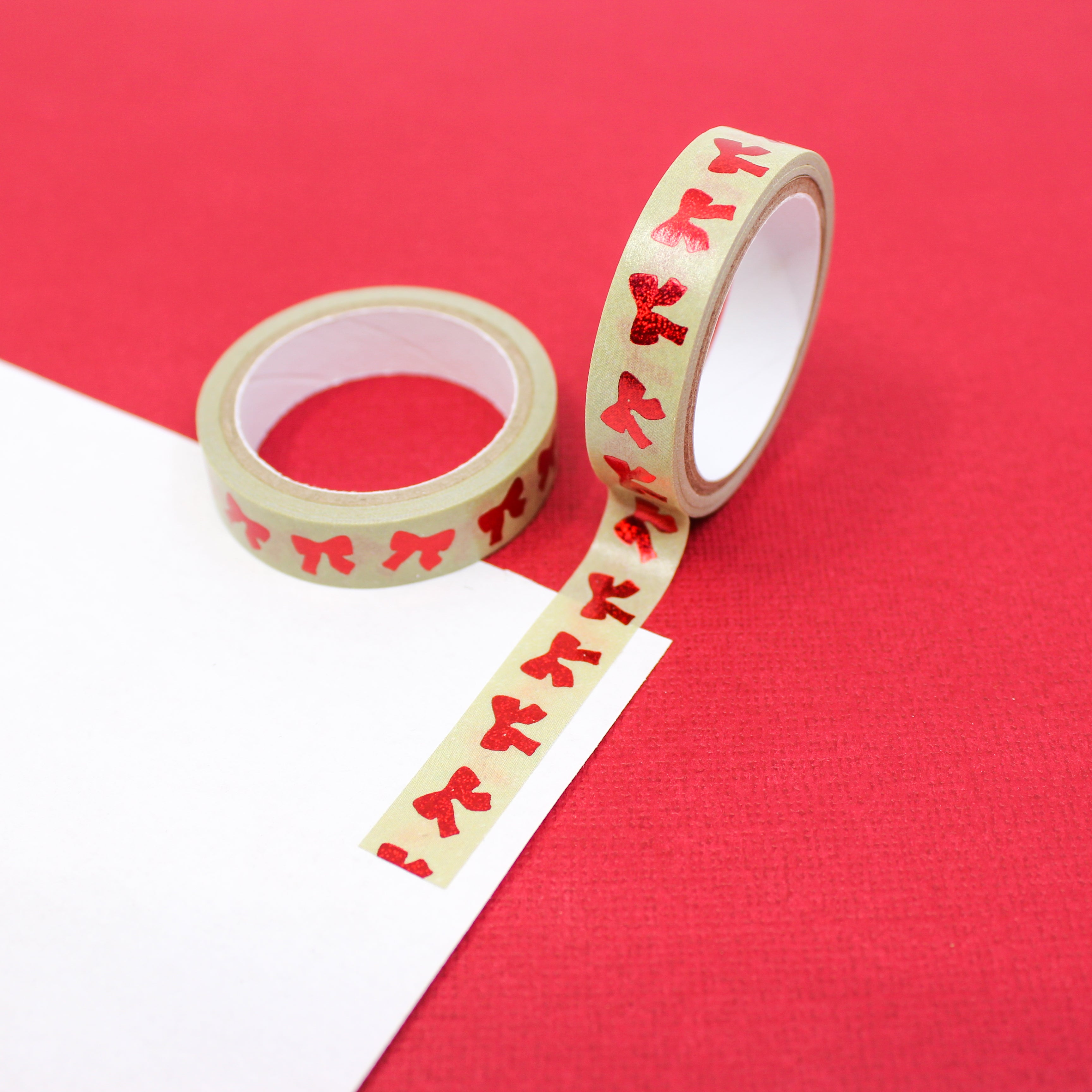 Infuse your creations with the magic of the holiday season using our washi tape adorned with classic red bow patterns, evoking the joy and festivity of holiday decorations. This tape is sold at BBB Supplies Craft Shop.