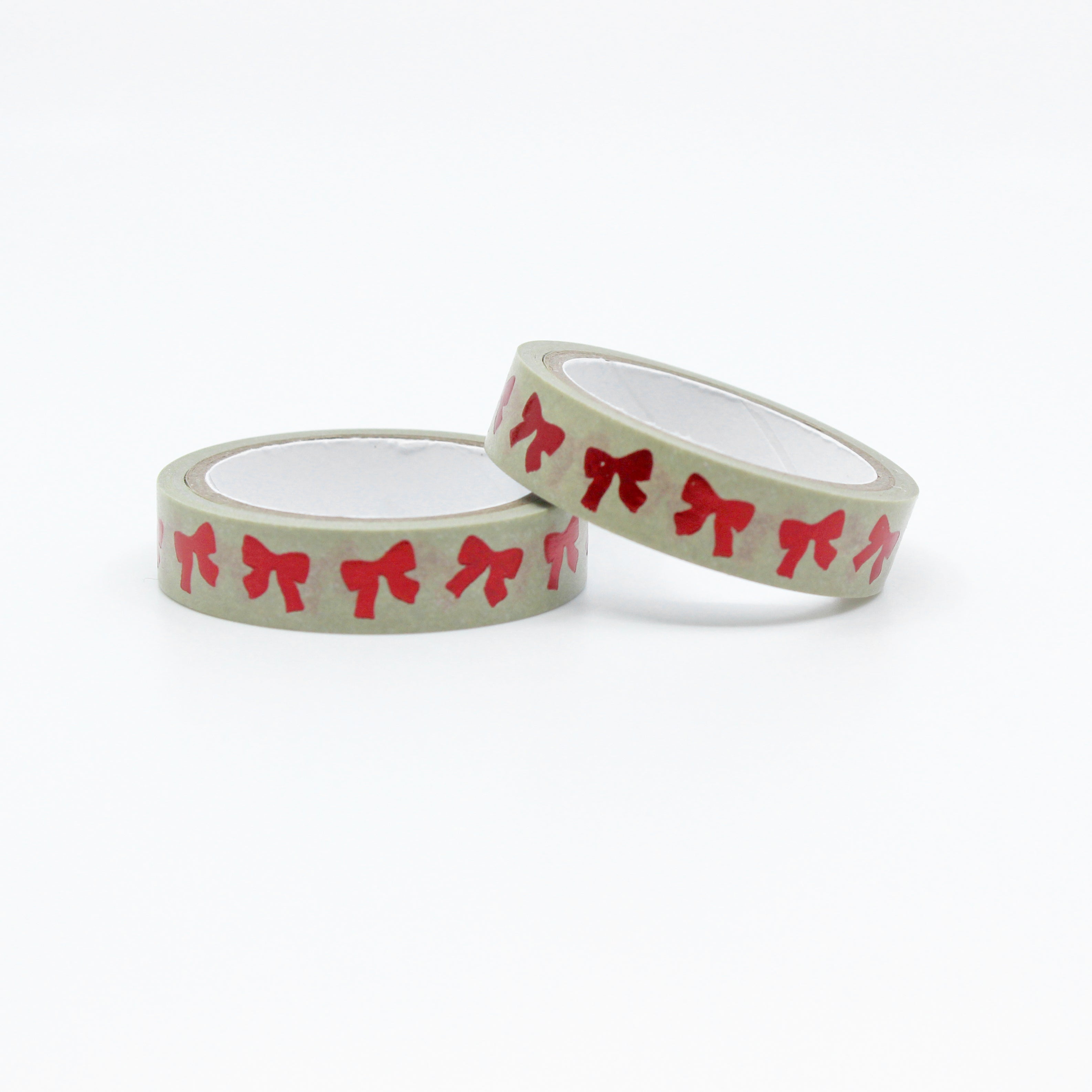 Infuse your creations with the magic of the holiday season using our washi tape adorned with classic red bow patterns, evoking the joy and festivity of holiday decorations. This tape is sold at BBB Supplies Craft Shop.