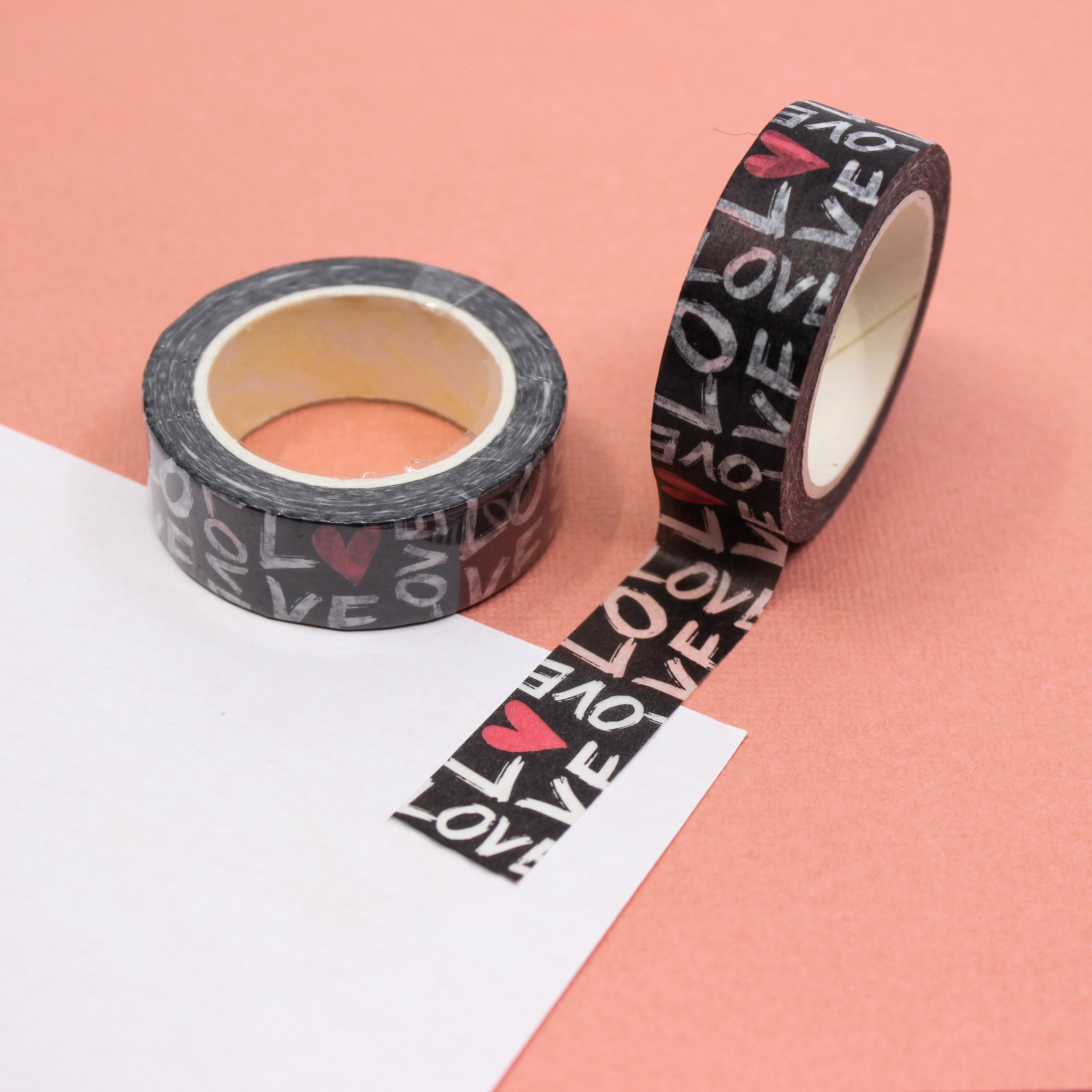 Elevate your crafts with this fun and graphic Love Typography Washi Tape. This tape uses a modern graffiti-style font to spell out expressions of love with heart motifs and is sold at BBB Supplies Craft Shop.