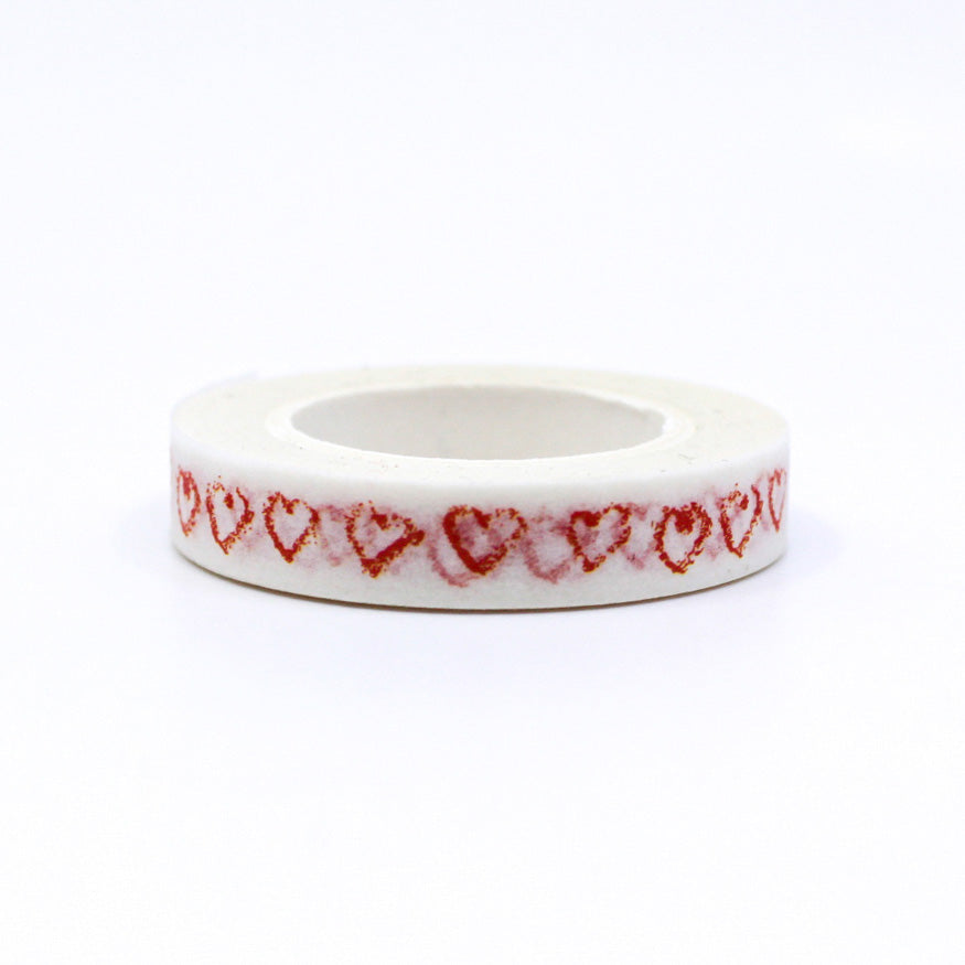 Elevate your projects with our Narrow Red Sketchy Hearts Border Washi Tape, adorned with charming and hand-drawn heart patterns. Ideal for adding a touch of playful romance to your crafts. This tape is sold at BBB Supplies Craft Shop.