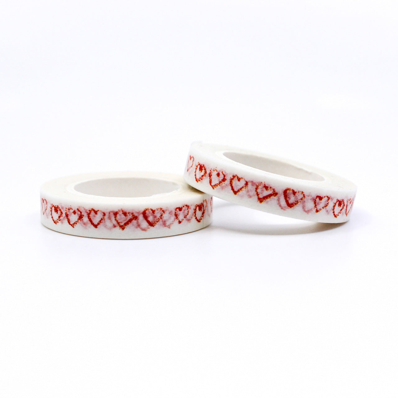 Elevate your projects with our Narrow Red Sketchy Hearts Border Washi Tape, adorned with charming and hand-drawn heart patterns. Ideal for adding a touch of playful romance to your crafts. This tape is sold at BBB Supplies Craft Shop.