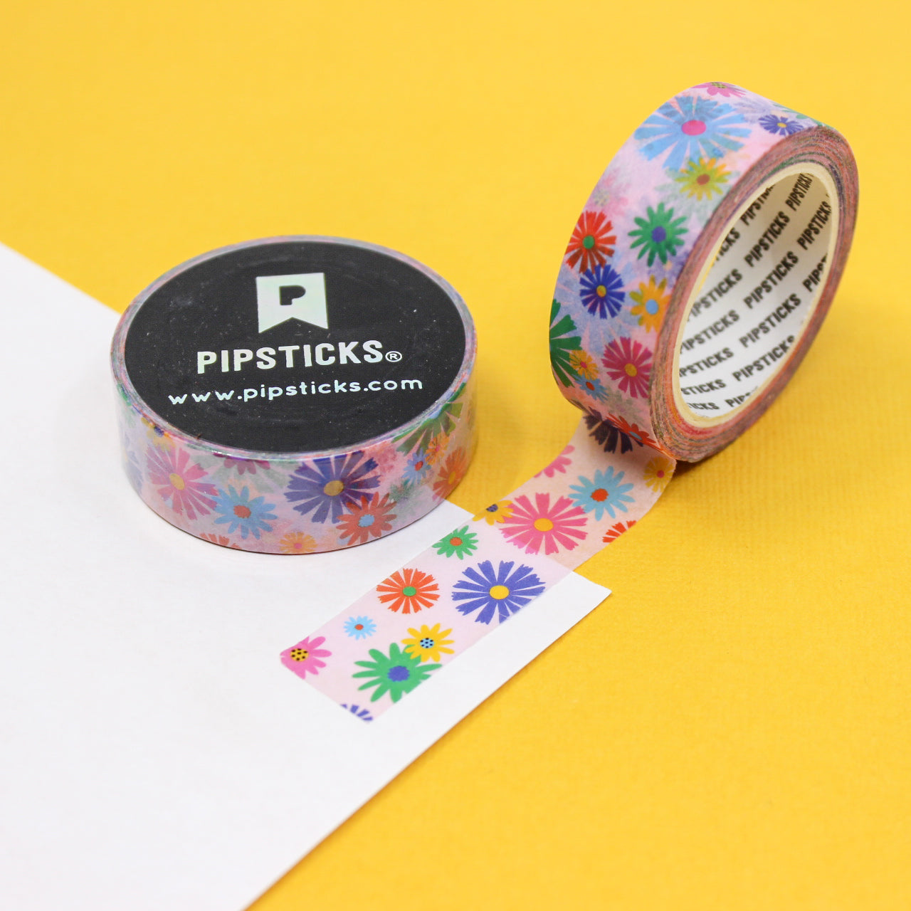 Infuse your creations with the spirit of flower power using our washi tape, featuring a lively combination of colorful flowers on a pink background, evoking a sense of positivity and retro charm. This tape is sold at BBB Supplies Craft Shop.