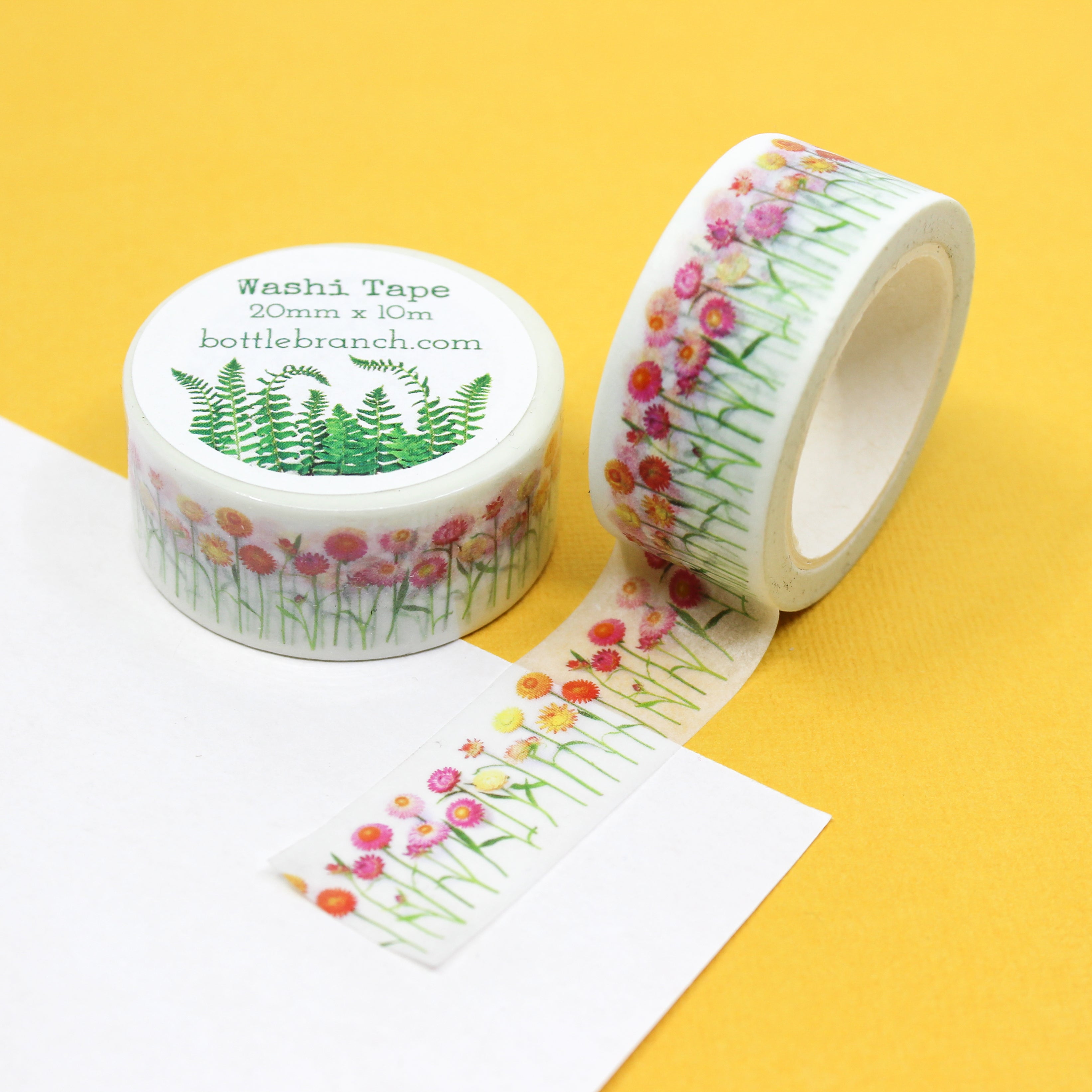 Elevate your crafts with our exquisite pink strawflower washi tape, adorned with intricate floral designs that exude grace and beauty. Add a touch of delicate elegance with our pink strawflower washi tape, featuring charming floral patterns in shades of pink, orange, and yellow. This tape is designed by bottle branch and sold at BBB Supplies Craft Shop.
