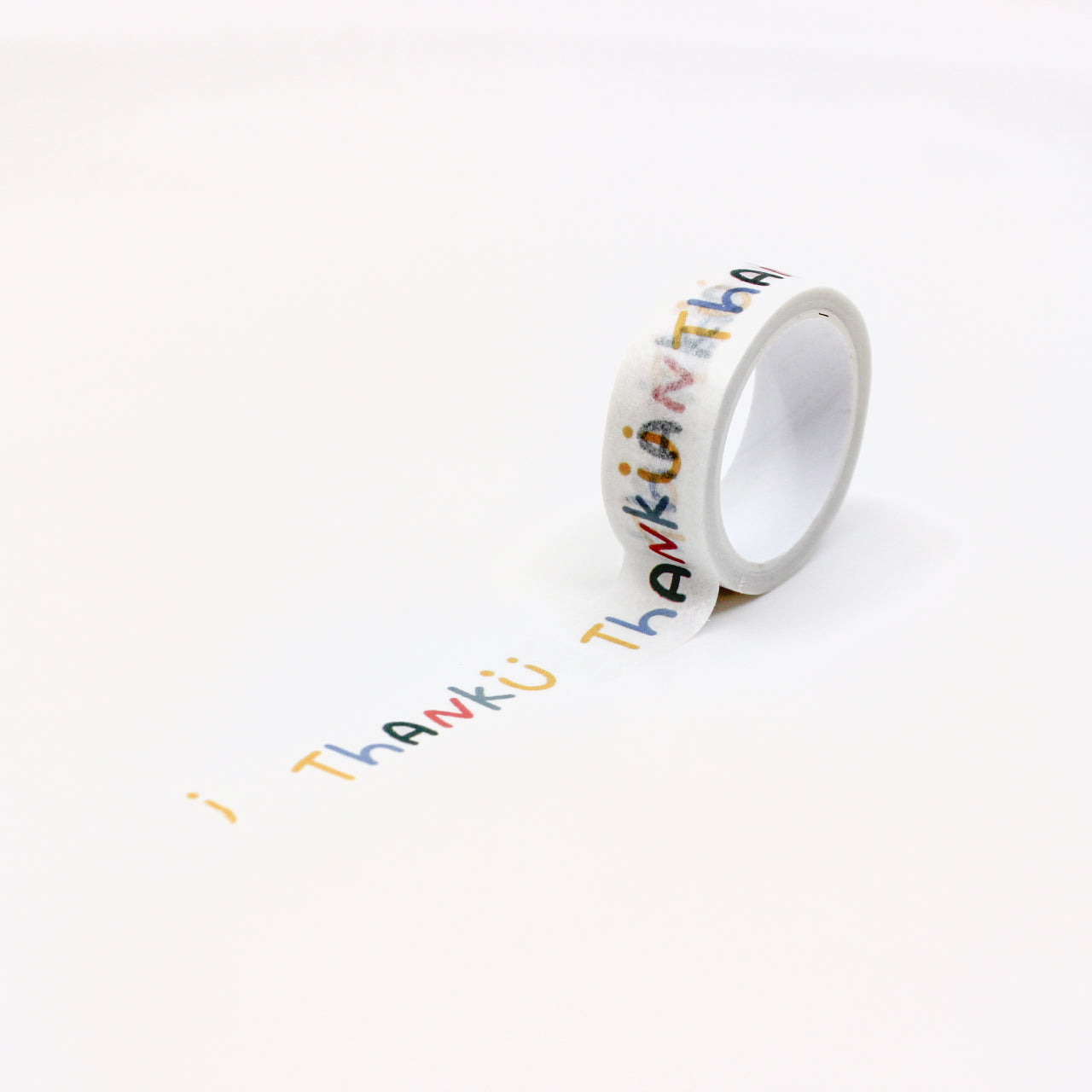 Vibrant washi tape featuring the words 'Thank U' alongside a cheerful smiling face. This playful design on a crisp white background adds a touch of gratitude and joy to your crafting projects. This tape is sold at BBB Supplies Craft Shop.