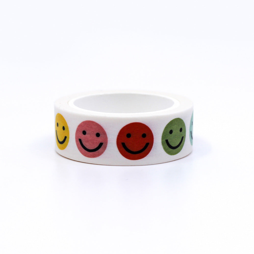 Vibrant Rainbow Colors Smiley Face Washi Tape, featuring cheerful expressions on a colorful background, adding a playful touch to your creative projects. This tape is from Worthwhile Papers and sold at BBB Supplies Craft Shop. 