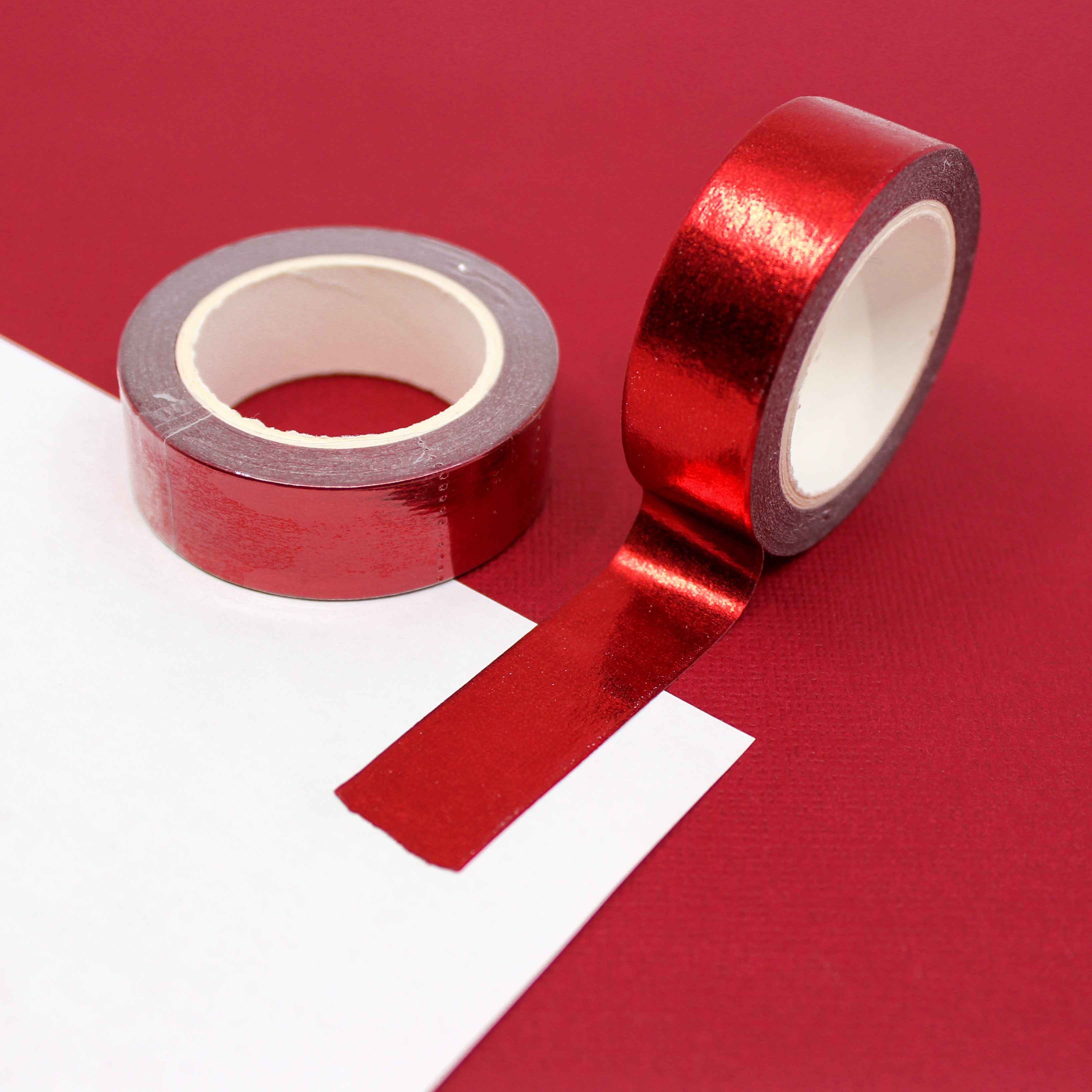 Add a touch of elegance to your crafts with our dazzling red foil washi tape, featuring a shimmering metallic finish that catches the light. This tape is sold at BBB Supplies Craft Shop.