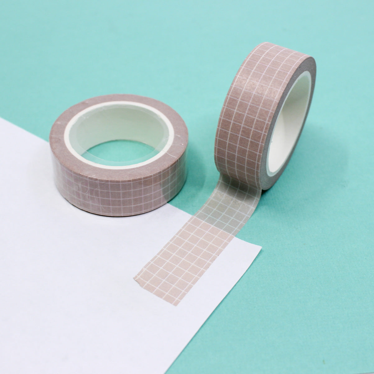 Soft neutrals grid washi tape in shades of soft pink, blush, light tan, and brown, featuring a minimalist grid pattern perfect for elegant and organized crafts.