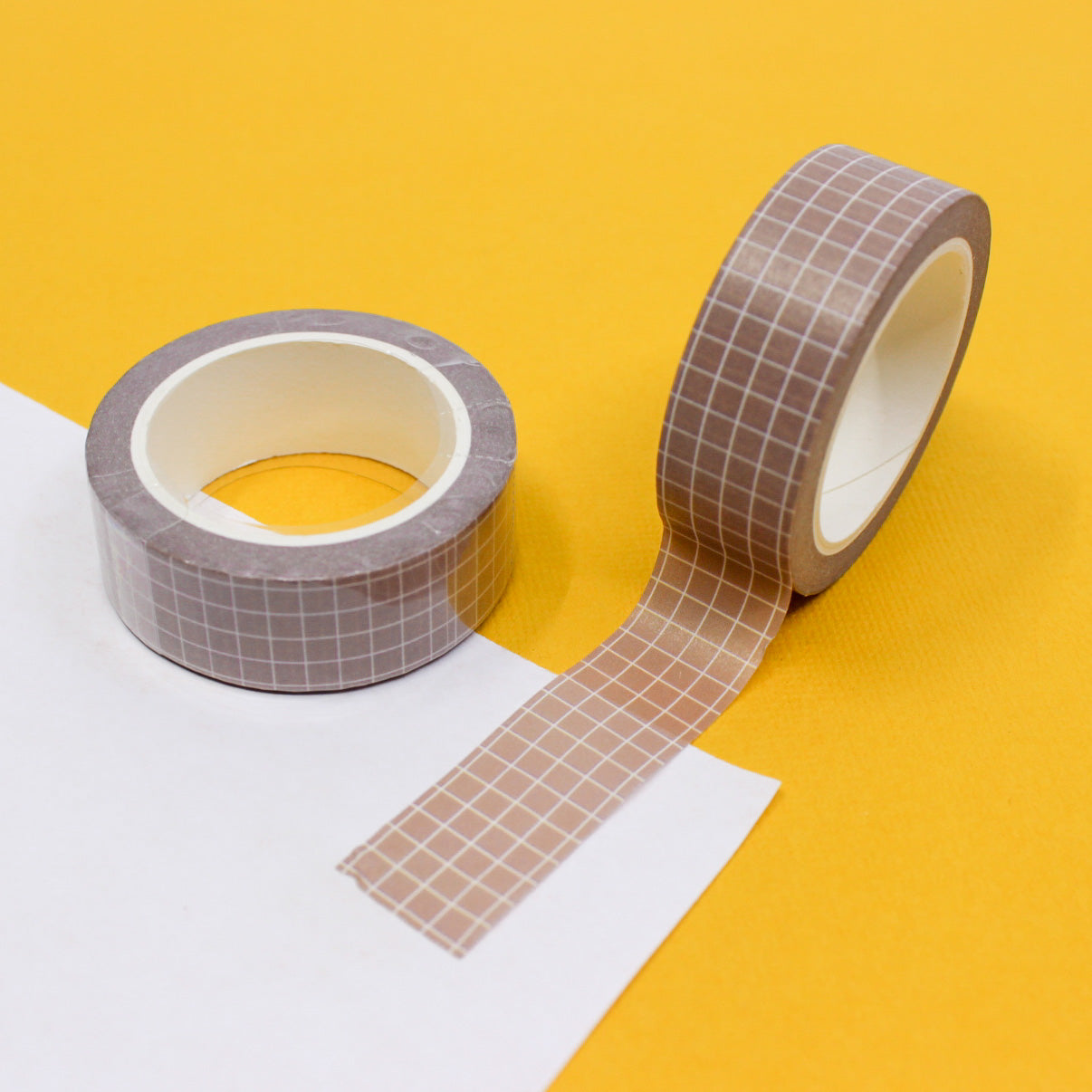 Soft neutrals grid washi tape in shades of soft pink, blush, light tan, and brown, featuring a minimalist grid pattern perfect for elegant and organized crafts.