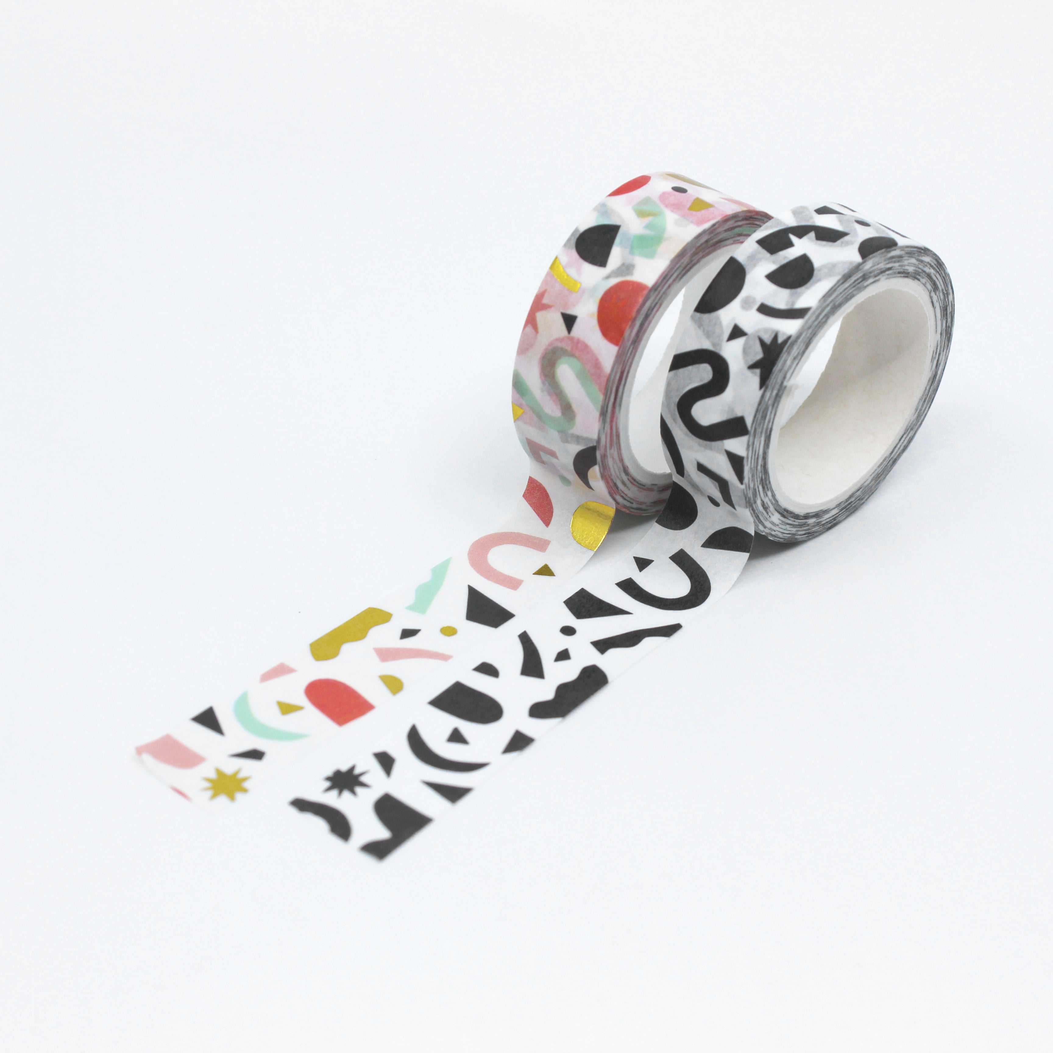 This is a photo of worthwhile papers brand washi tapes in the colorful geometric shapes pattern and in the black and white pattern from bbb supplies.