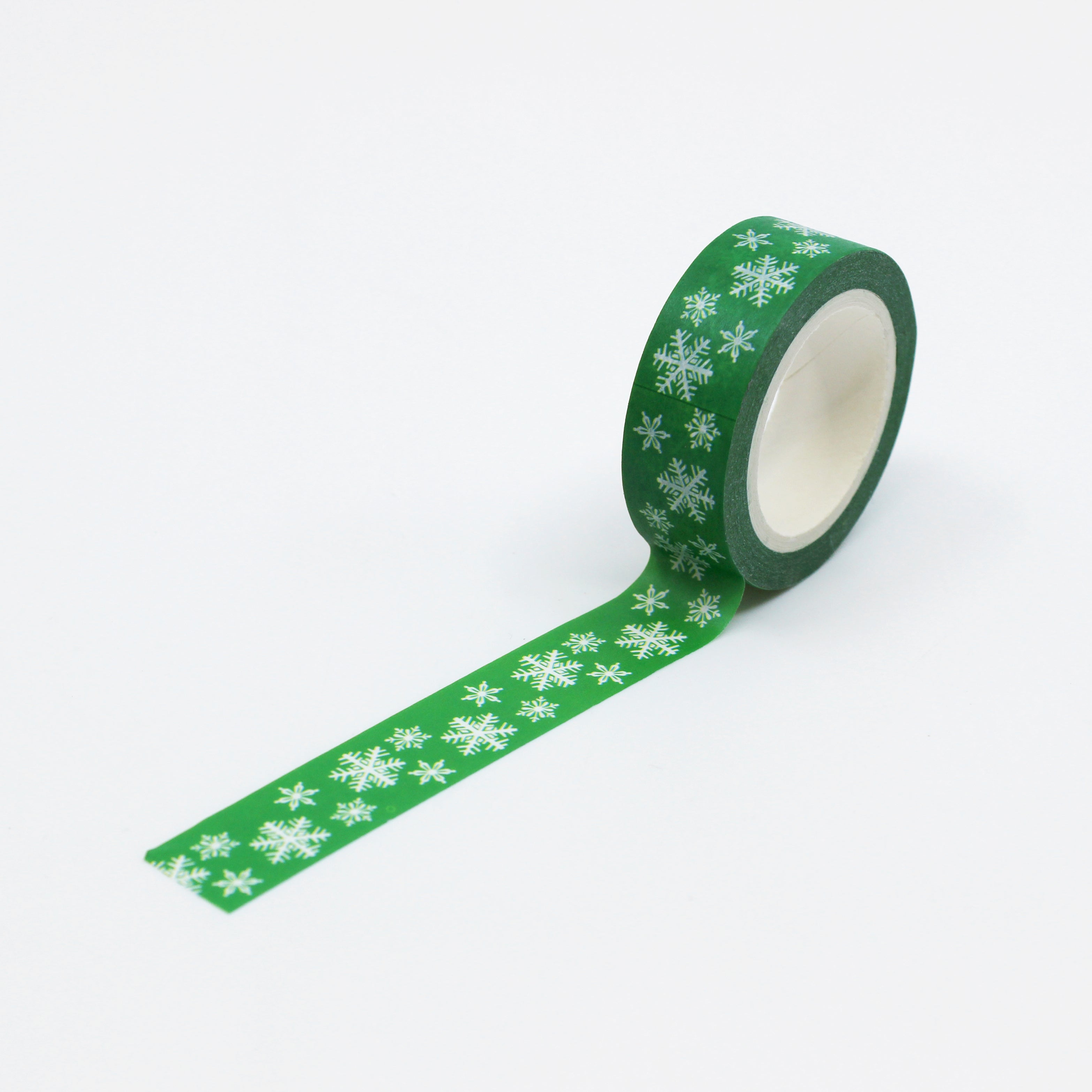 This is a full pattern repeat view of green snow flakes washi tape from BBB Supplies Craft Shop