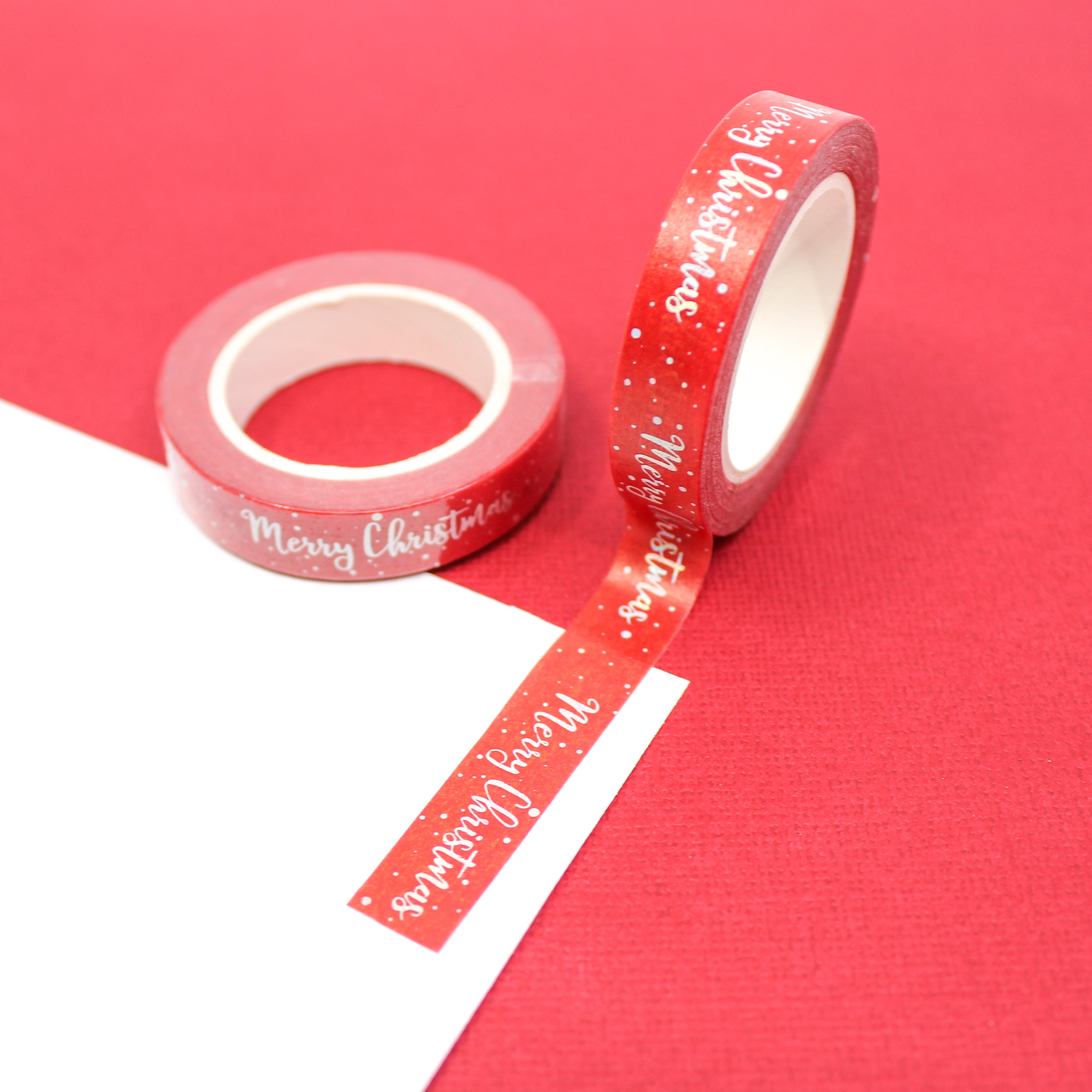 This is a Holiday Merry Christmas greetings in cursive writing washi tape from BBB Supplies Craft Shop