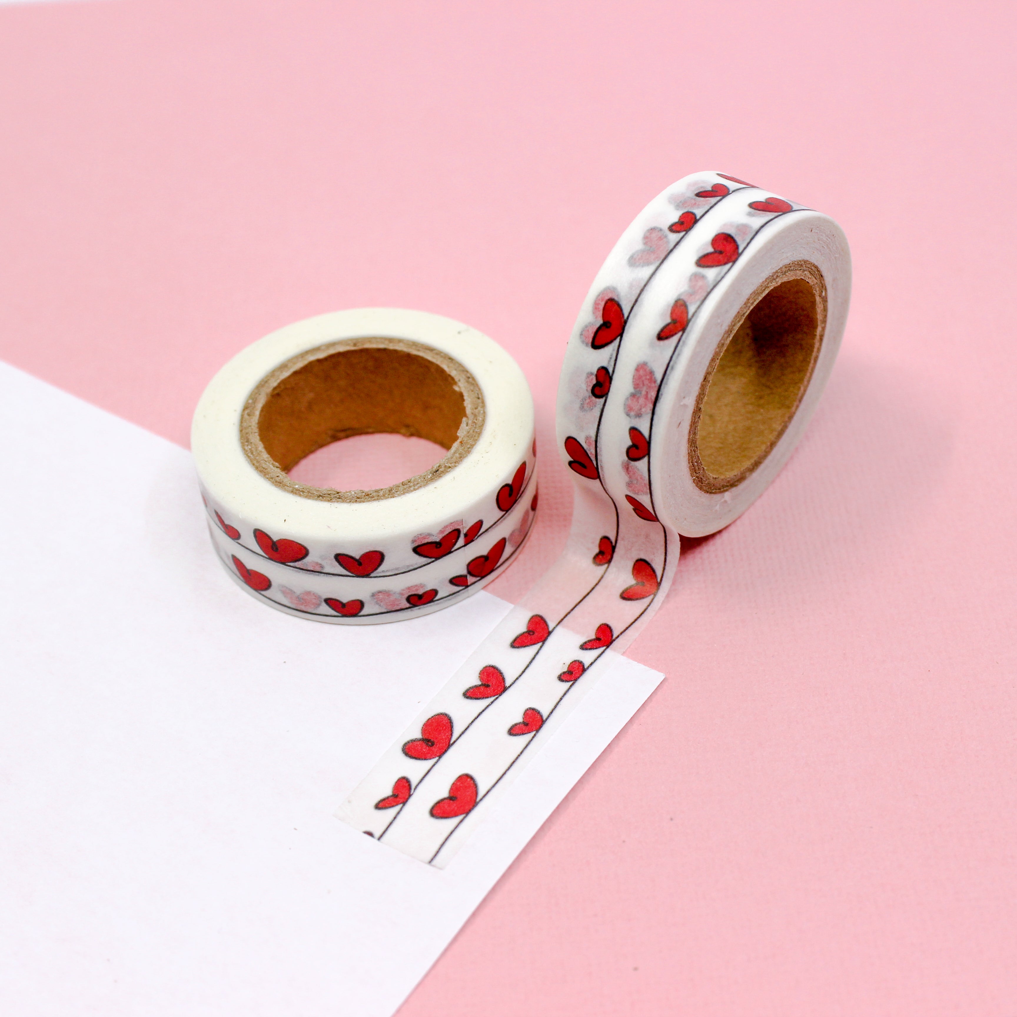 This is a red hearts on a wire view themed washi tape from BBB Supplies Craft Shop